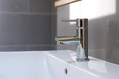 a bathroom sink with a chrome water faucet at Granary Lodge in Girthon