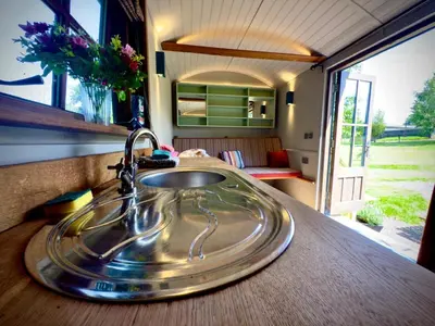 a sink in a bathroom in a caravan at Highland Hideaway in Wigton