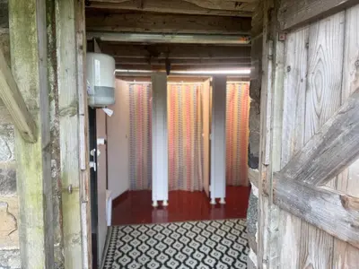 an entrance to a hallway with a wooden door at Highland Hideaway in Wigton