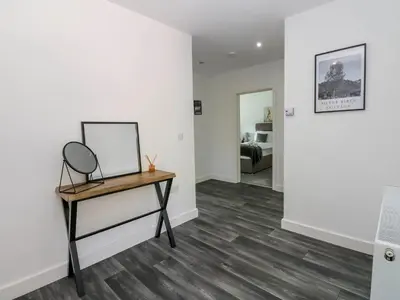 a room with a mirror and a table with a mirror at Silverbirch Cottage - 3 Bedrooms - Sleeps 6 in Frizington