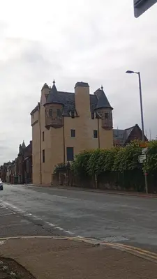 a large building on the side of a street at The Cassillis Hotel - Smart Self Check-in Hotel & Bar in Maybole