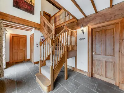 a wooden spiral staircase in a room with wooden walls at Engine House - Uk48912 in Allonby