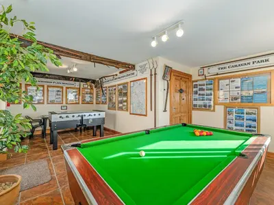 a pool table in the middle of a room at Engine House - Uk48912 in Allonby