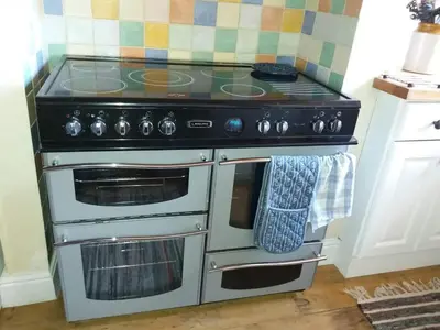 a kitchen with an oven with a stove top at Rose cottage on the peaceful solway coast in Port Carlisle