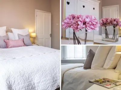 a bedroom with a bed and a vase of pink flowers at Skyfell House in Keswick
