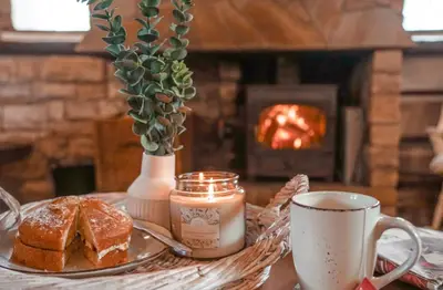 a table with a plate of bread and a cup of coffee at Riverside Country House and Cottage in Sunderland