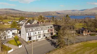 an aerial view of a large white house at Stanley House in Bassenthwaite