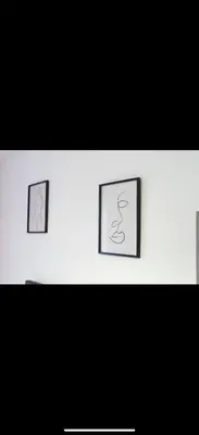 three pictures on a wall with black and white at Warwick Studio Spaces in Carlisle