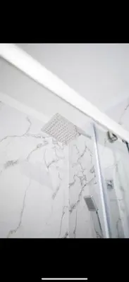 a white marble counter top with a shower stall at Warwick Studio Spaces in Carlisle