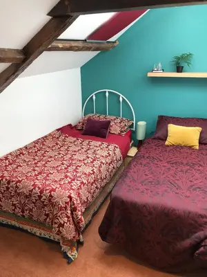 two beds sitting next to each other in a room at Harbour view retreat in Isle of Whithorn