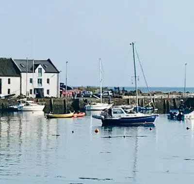 a group of boats are docked in a harbor at Harbour view retreat in Isle of Whithorn