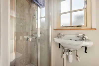 a bathroom with a sink and a shower at 1 Bed in Uldale oc-m31080 in Uldale