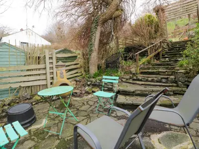 a group of chairs and tables in a yard at The Lamphouse in Stranraer