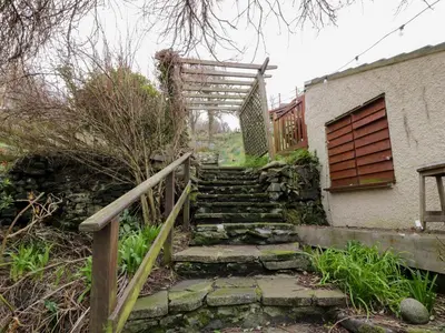 a set of stairs leading up to a house at The Lamphouse in Stranraer