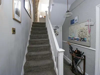 a staircase in a home with a stair case at Raise View House in Ambleside