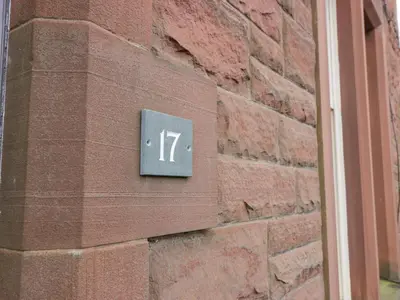 a sign on the side of a brick building at Hildawn in Dumfries