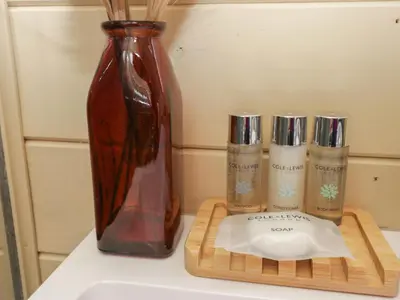 a vase sitting on top of a counter with a cutting board at Binsey Lodge in Wigton