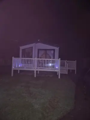 a white gazebo at night with blue lights at 2 bedroom platinum in Minishant
