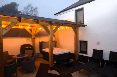 a gazebo with a tub on a patio at 1 Bed in Cockermouth oc-s31514 in Embleton
