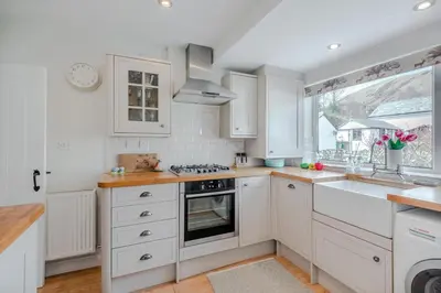 a kitchen with white cabinets and a sink at 2 Bed in Braithwaite oc-p31730 in Braithwaite