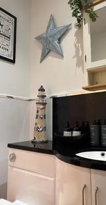 a kitchen counter with a starfish on the wall at Saltayr in Ayr