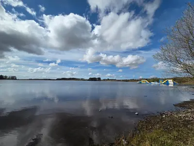 a large body of water with a cloudy sky at The Canny View at Three Lochs Holiday Park in Balminnoch 3 bedroom sleeps upto 8 guests in Newton Stewart