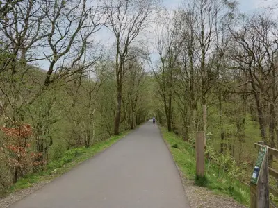 a path in a park with a person walking on it at Hodge Luxury Pod in Keswick