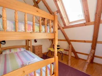a bedroom with two bunk beds and a window at Villa Rabbie Burns Lodge by Interhome in Straiton