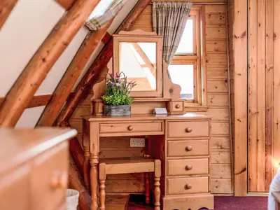 a dressing table and mirror in a tiny house at Villa Rabbie Burns Lodge by Interhome in Straiton