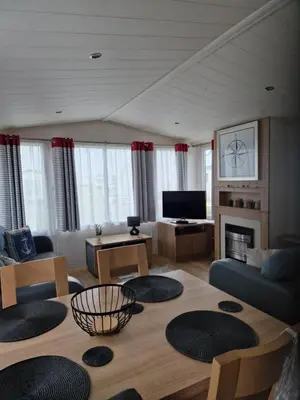 a living room with a couch and a table at Manannan in Maryport