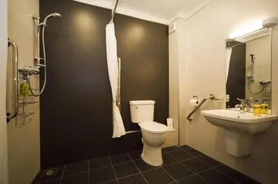 a bathroom with a toilet and a sink at Sandhills Farm in Bassenthwaite