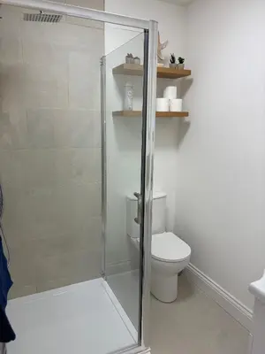 a bathroom with a shower and a toilet at Modern 3-Bedroom, central Kirkcudbright in Kirkcudbright
