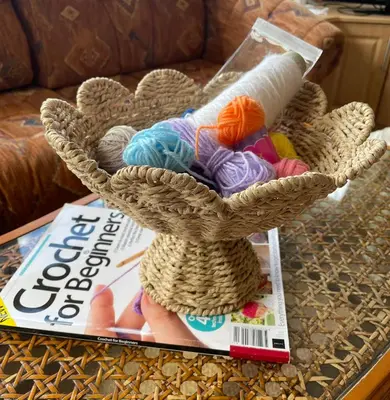 a basket of yarn sitting on top of a table at Grannys Vintage Coastal Caravan in Kippford