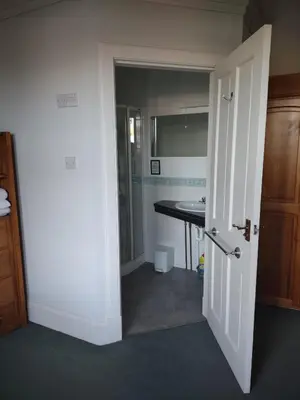 an open door to a bathroom with a sink at 95 St Mary Street in Kirkcudbright