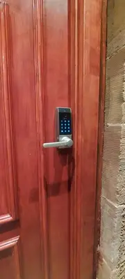 a wooden door with a cell phone on it at Hotel Room in Maybole for Work Travel & Leisure in Maybole