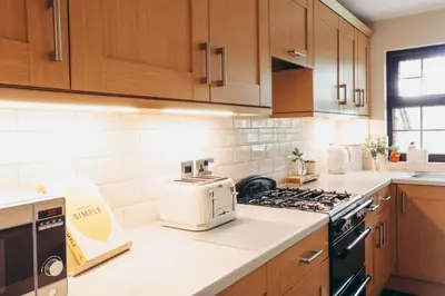a kitchen with a toaster sitting on a counter at North Lakes - The Fold Holiday Cottage in Penrith