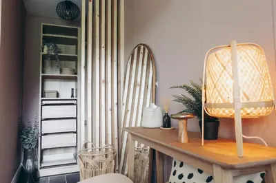 a room with a bunch of surfboards on a wall at North Lakes - The Fold Holiday Cottage in Penrith