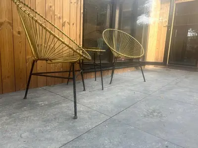 a couple of chairs sitting on a porch at Scotney Retreat in Moffat