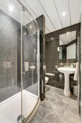 a bathroom with a shower and a sink at Burnmoor in Keswick
