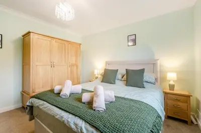 a bedroom with a bed with towels on it at 3 Bed in Aspatria oc-w31951 in Hayton