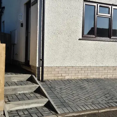 a building with steps leading up to a door at Manesty House - Rooms only - no kitchen-living in Keswick