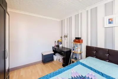 a bedroom with a bed and a desk at Guild Close in Moffat