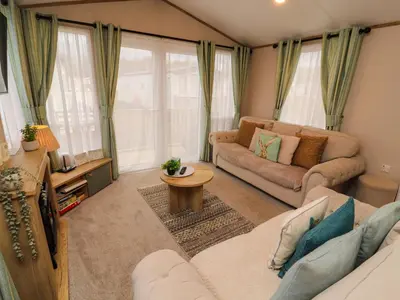 a living room with a couch and a table at Seren in Cockermouth