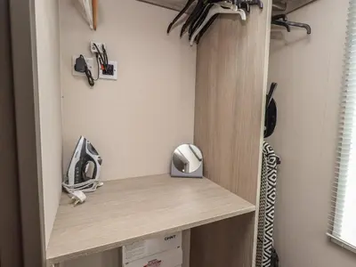 a room with a shelf with a phone and other items at Haven in Cockermouth