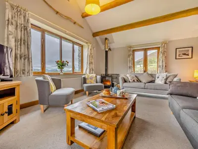 a living room with a couch and a table at 3 Bed in Keswick oc-93590 in Threlkeld