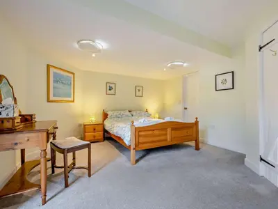 a bedroom with a bed and a desk in it at 3 Bed in Keswick oc-93590 in Threlkeld