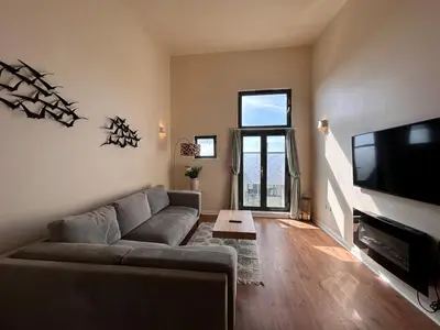 a living room with a couch and a flat screen tv at Marina 2bedroom Beach Nearby Swansea City in Moffat