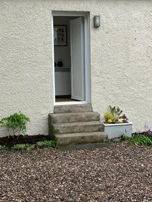 a door to a house with stairs leading to it at Wee Lyon Cottage Maybole 2 Bedroom Sleeps 4 in Maybole