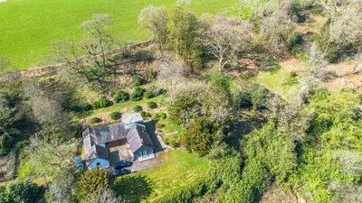 an aerial view of a house in a field at The Stables Cottage, Beattock, Moffat in Beattock