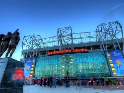 a group of people standing outside of a baseball stadium at New Stylish Large 1-Bed Apartment - Close to Old Trafford & More in Moffat